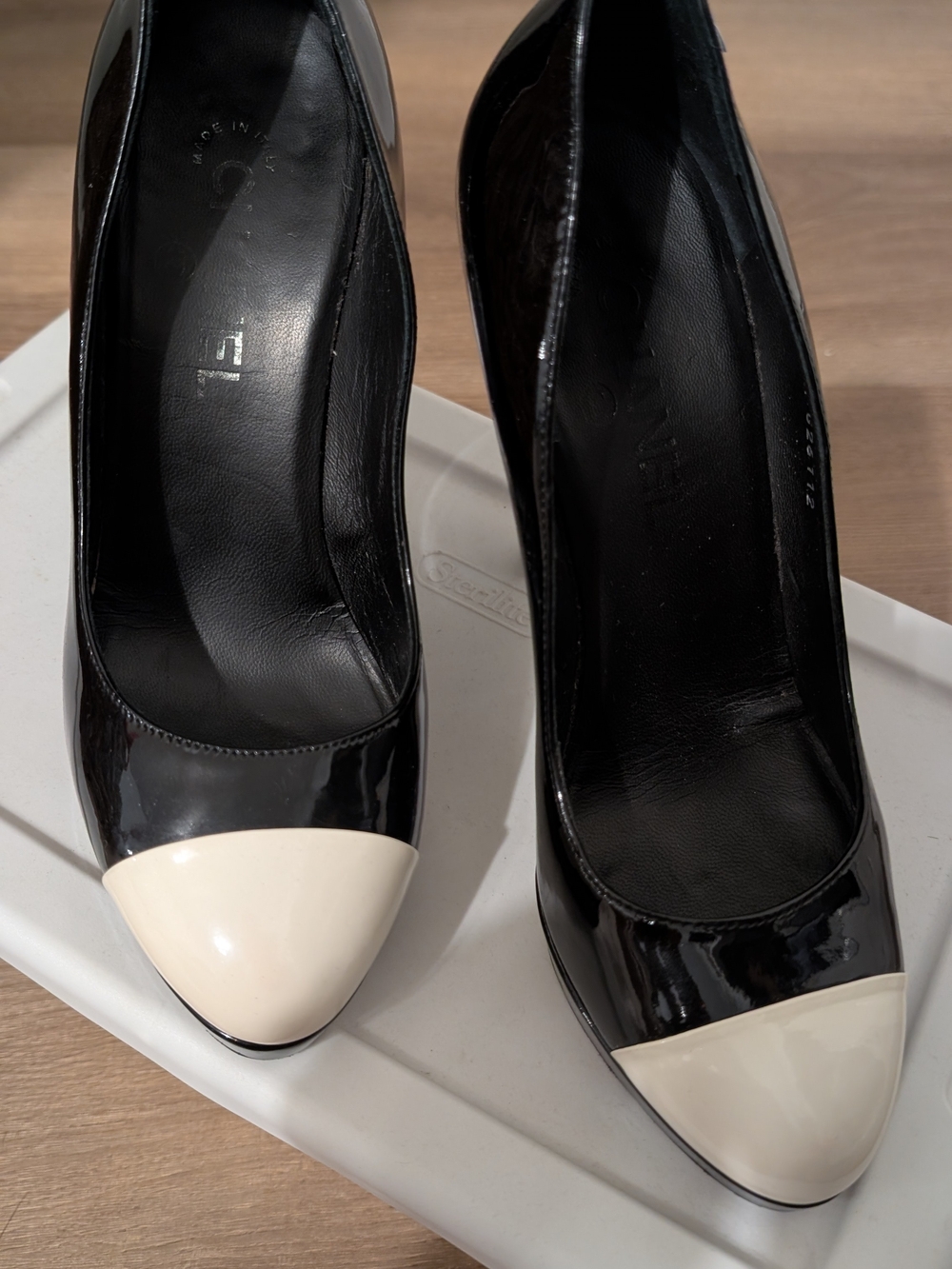 CHANEL Black Patent Pumps with Cream Cap Toe - Women's